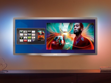 Der Cinema 21:9 Gold von Philips erlaubt es, sich Filme im Cinemascopeformat anzuschauen. Die schwarzen Balken fallen weg und das Bild wirkt wesentlich grösser. Das elegante Gerät verfügt über Ambilight Spectra 2 und ist selbstverständlich netzwerkfähig. Mittels Simply Share können Dateien von jedem Gerät auf den Fernseher gebracht werden. Die Steuerung kann nach Belieben auch per Tablet, Smartphone oder Tastatur erfolgen.